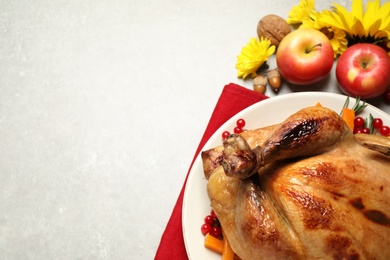 Photo of Traditional cooked turkey and autumn decor on light table, flat lay with space for text. Thanksgiving day celebration