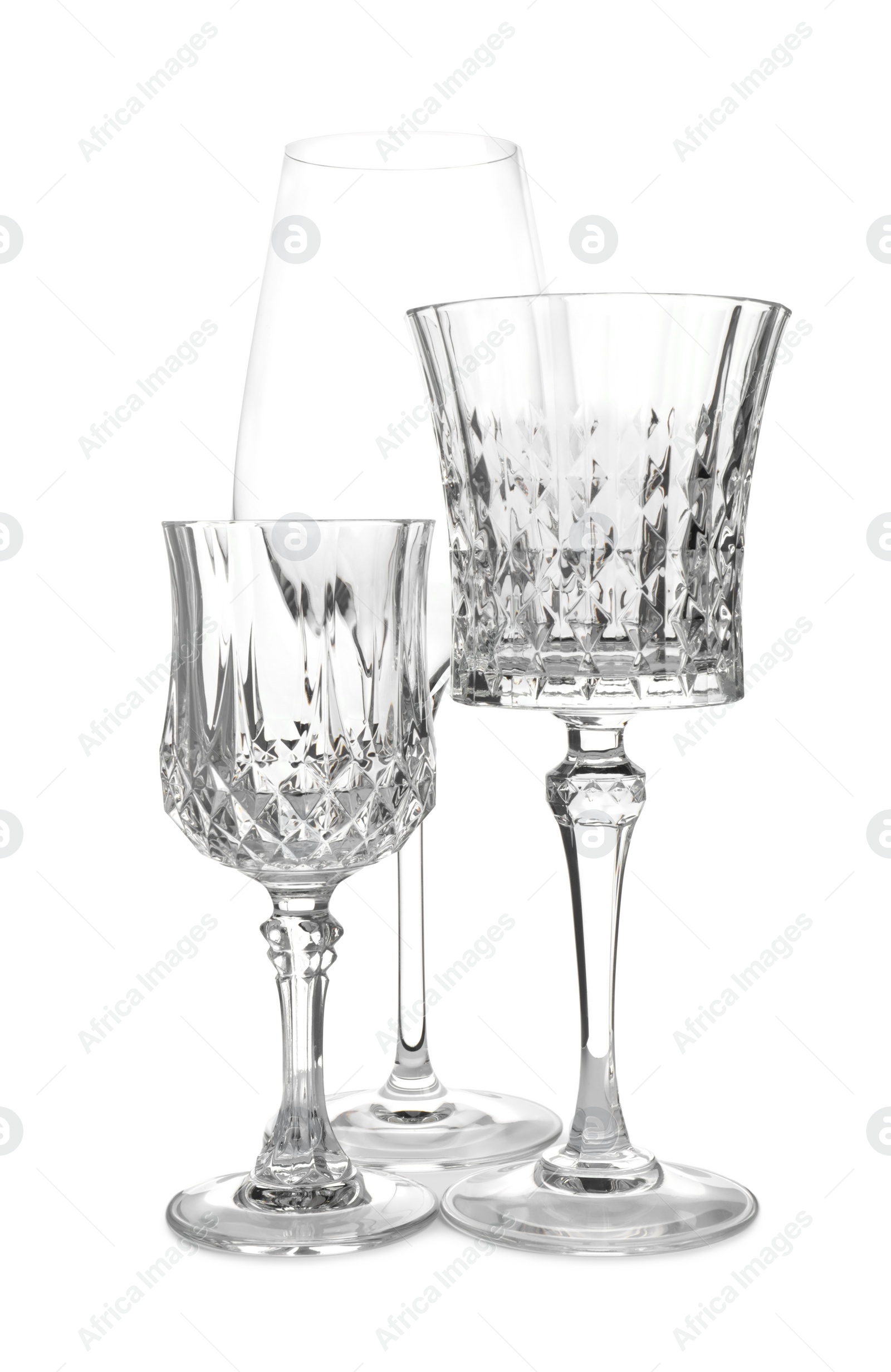 Photo of Different elegant empty glasses isolated on white