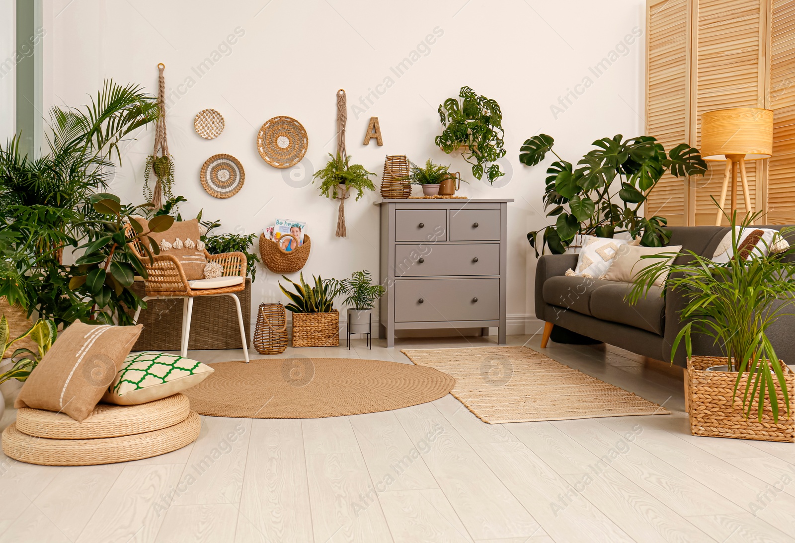 Photo of Living room interior with stylish furniture and green plants