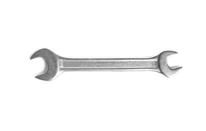 Photo of New wrench on white background, top view. Construction tools