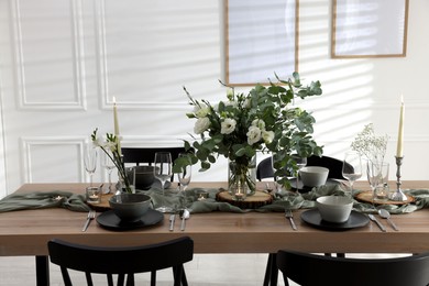 Photo of Festive table setting with beautiful tableware and decor indoors