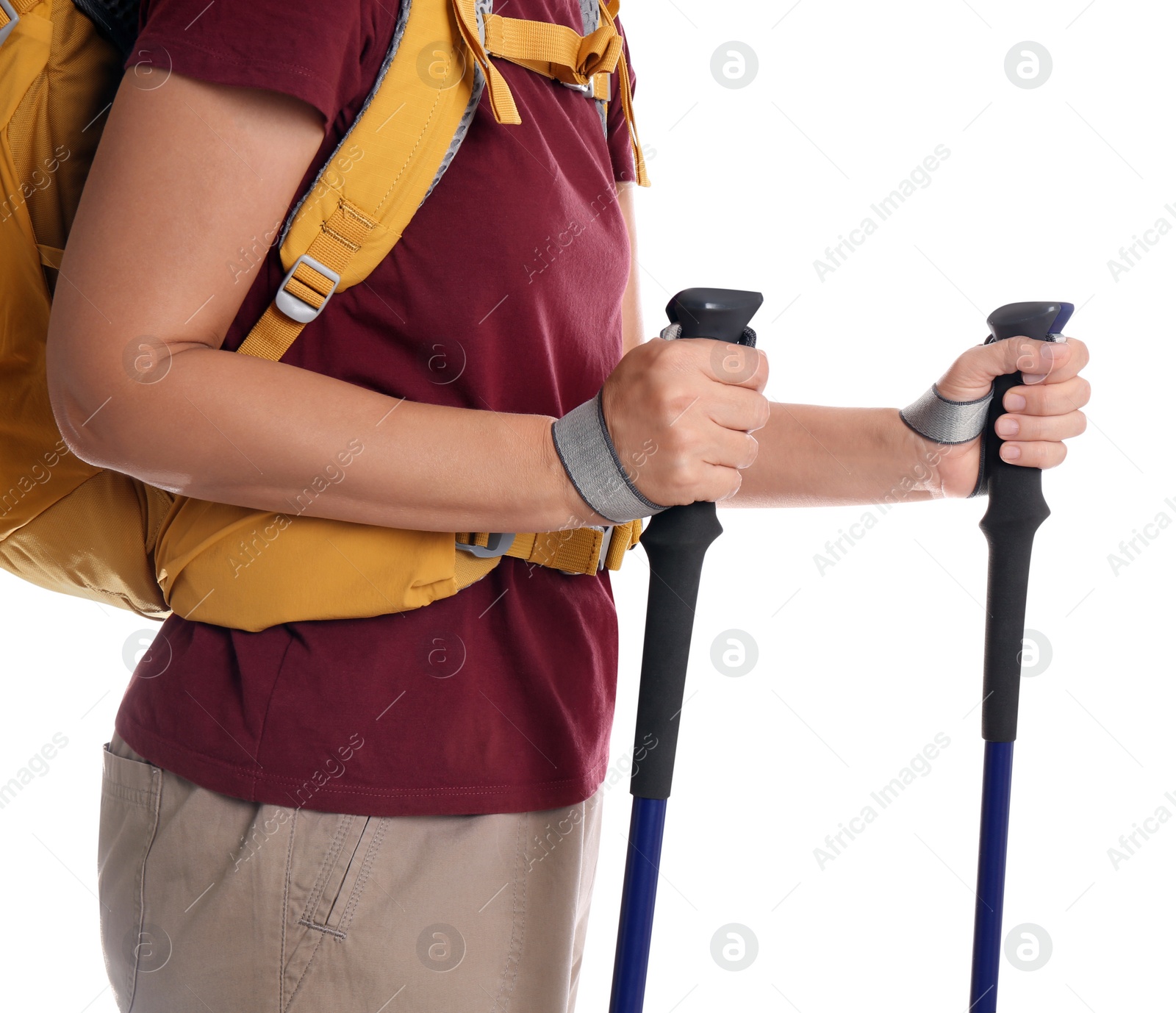 Photo of Female hiker with backpack and trekking poles on white background, closeup