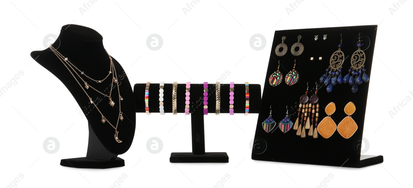 Photo of Different display stands with stylish jewelry on white background