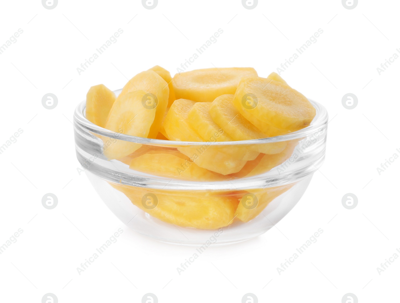 Photo of Slices of raw yellow carrot in glass bowl isolated on white
