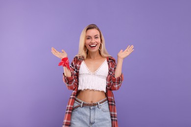 Photo of Portrait of happy hippie woman on purple background