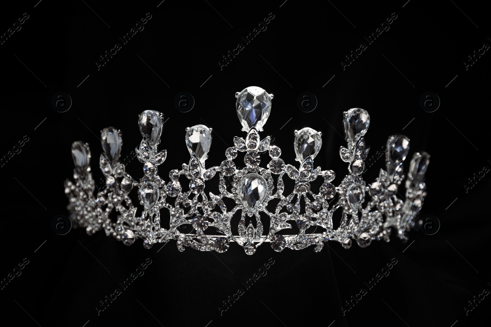 Photo of Beautiful silver tiara with diamonds on black background