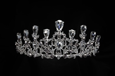 Photo of Beautiful silver tiara with diamonds on black background