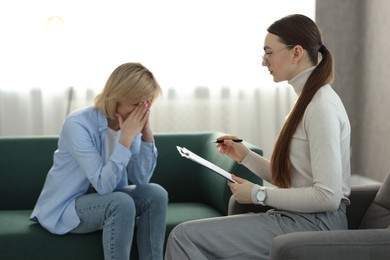 Professional psychotherapist working with patient in office