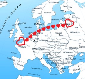 Love in long-distance relationship. Connecting line of red hearts between European countries on world map