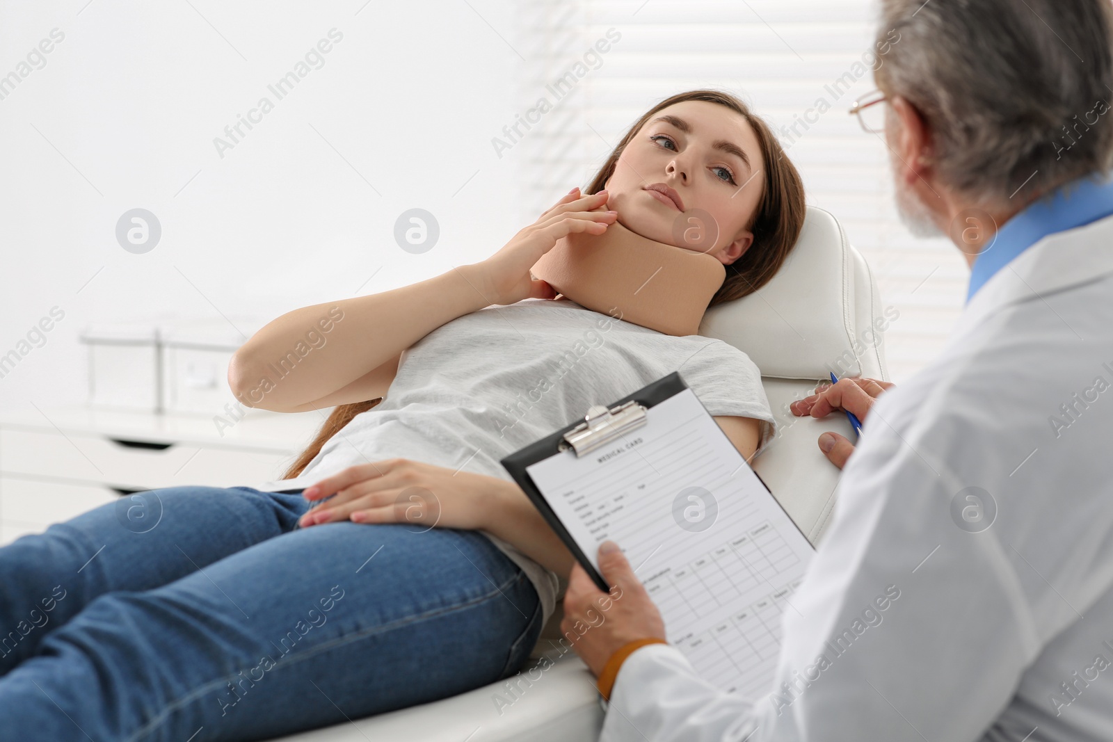 Photo of Doctor filling patient's medical card in clinic