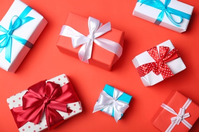 Photo of Flat lay composition with beautiful gift boxes on color background