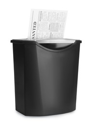 Paper shredder with newspaper isolated on white