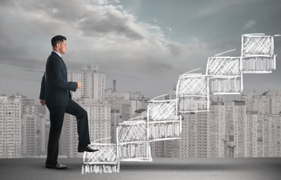 Businessman walking up stairs drawing with chalk and cityscape on background. Career ladder concept