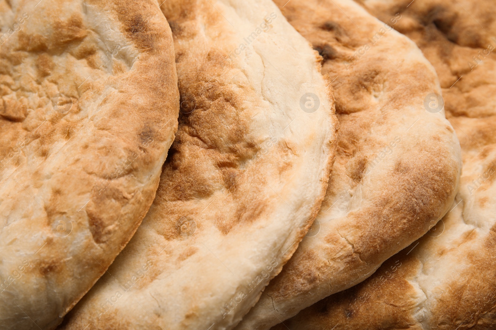 Photo of Delicious fresh pita bread as background, closeup