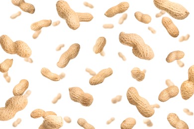 Image of Unpeeled peanuts in air on white background