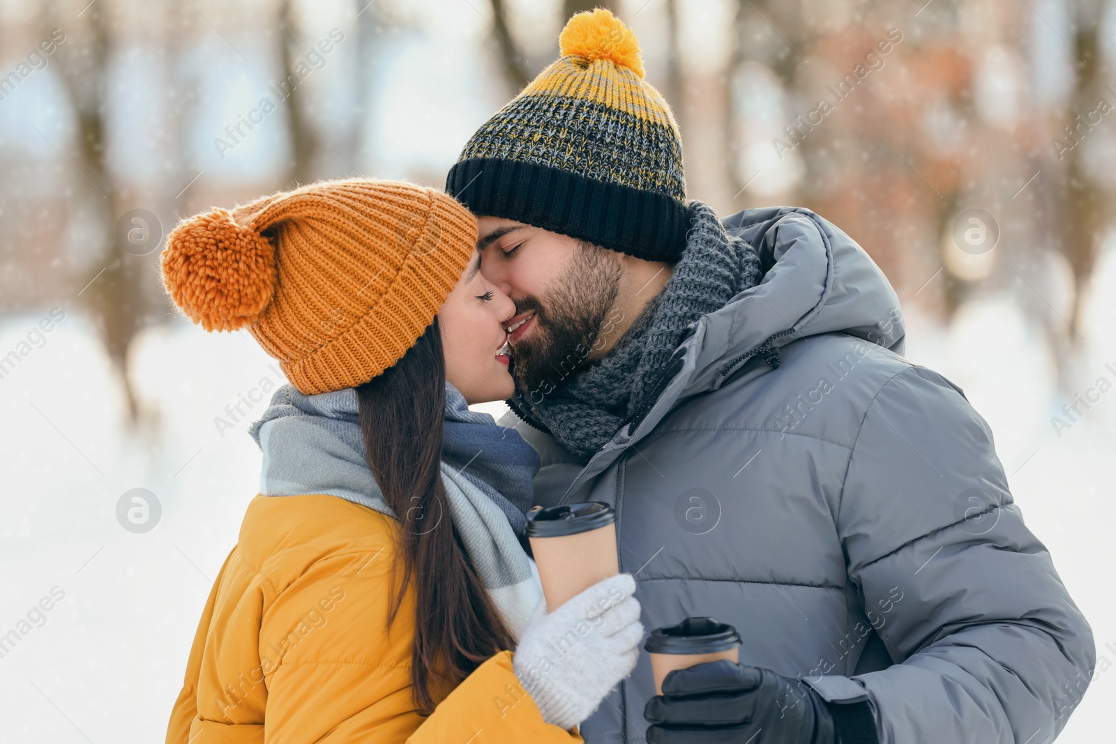 Photo of Beautiful young couple enjoying winter day outdoors