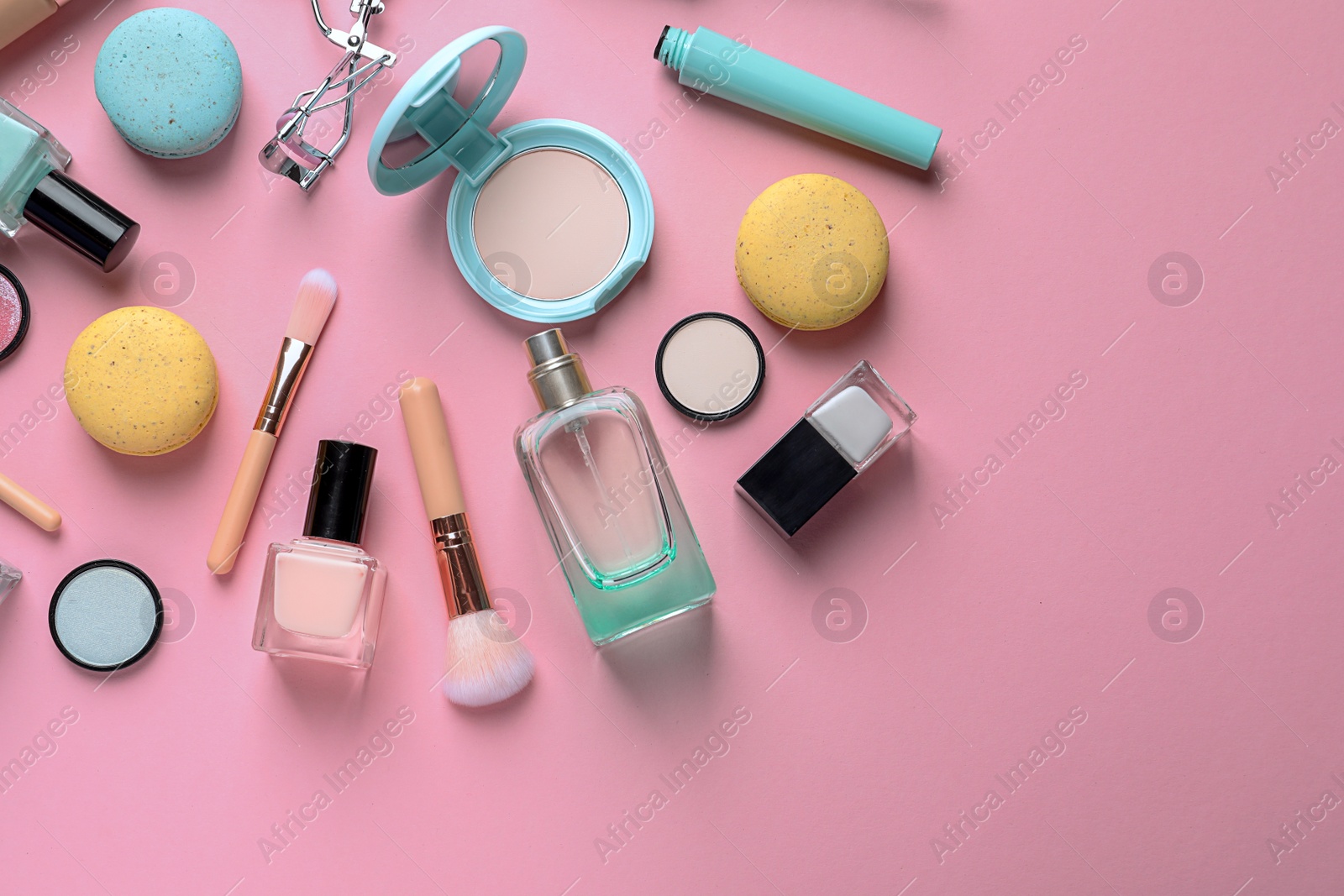 Photo of Flat lay composition with decorative cosmetics on color background