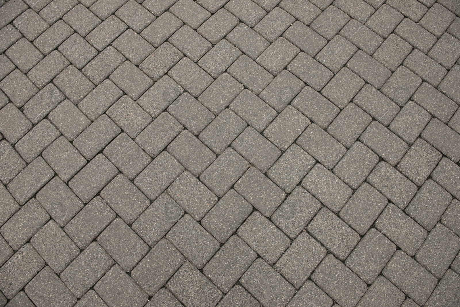 Photo of View on stone sidewal, top view. Footpath covering