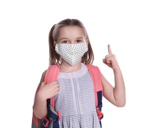 Photo of Little girl wearing protective mask with backpack on white background. Child safety