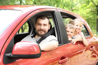 Happy family with children taking road trip together