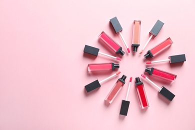 Photo of Composition of lipsticks on color background, flat lay. Space for text