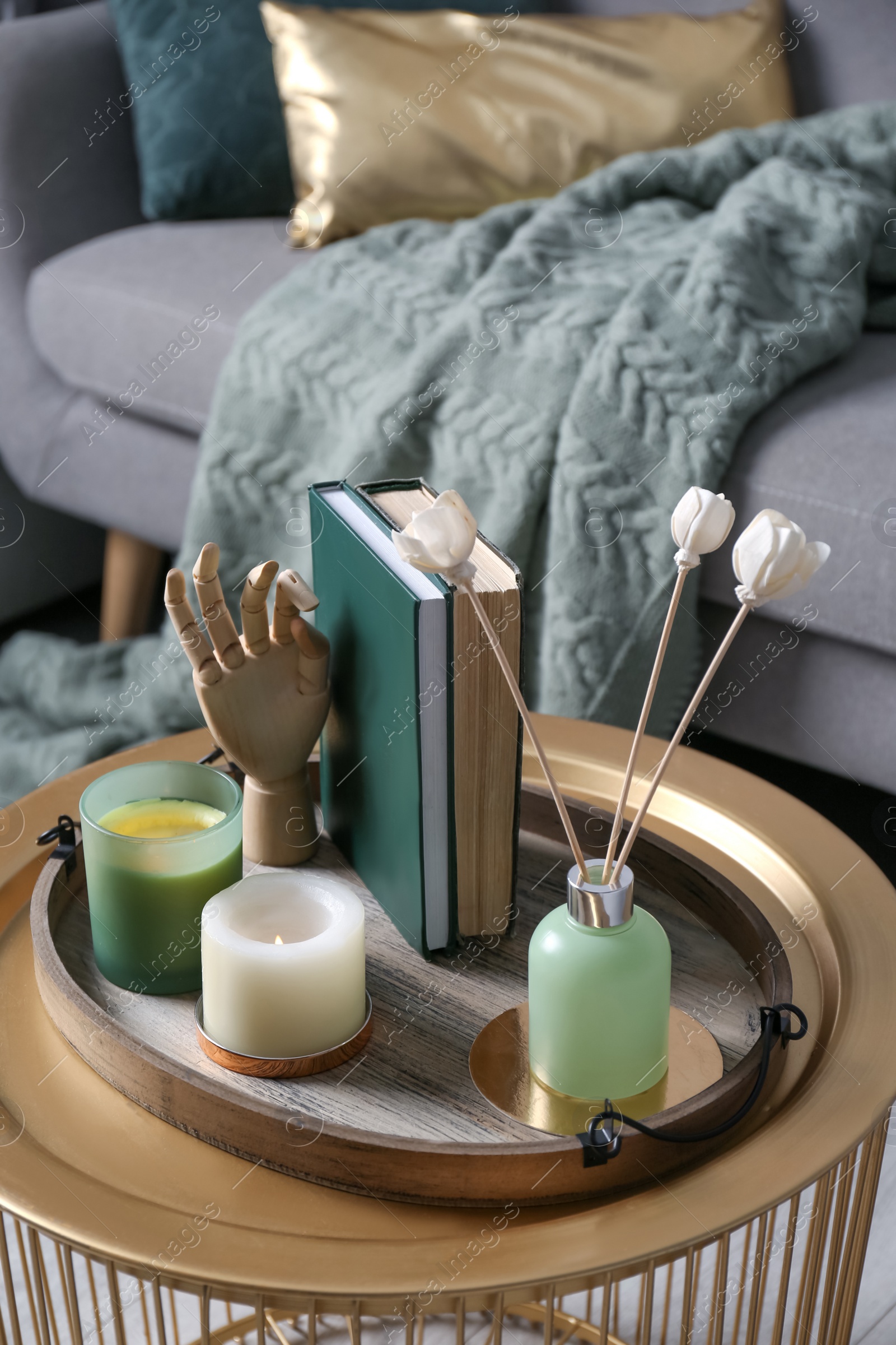 Photo of Stylish tray with different interior elements on table in living room