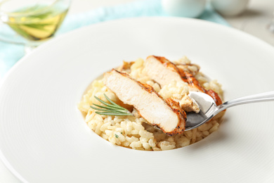 Photo of Delicious fresh chicken risotto in plate, closeup