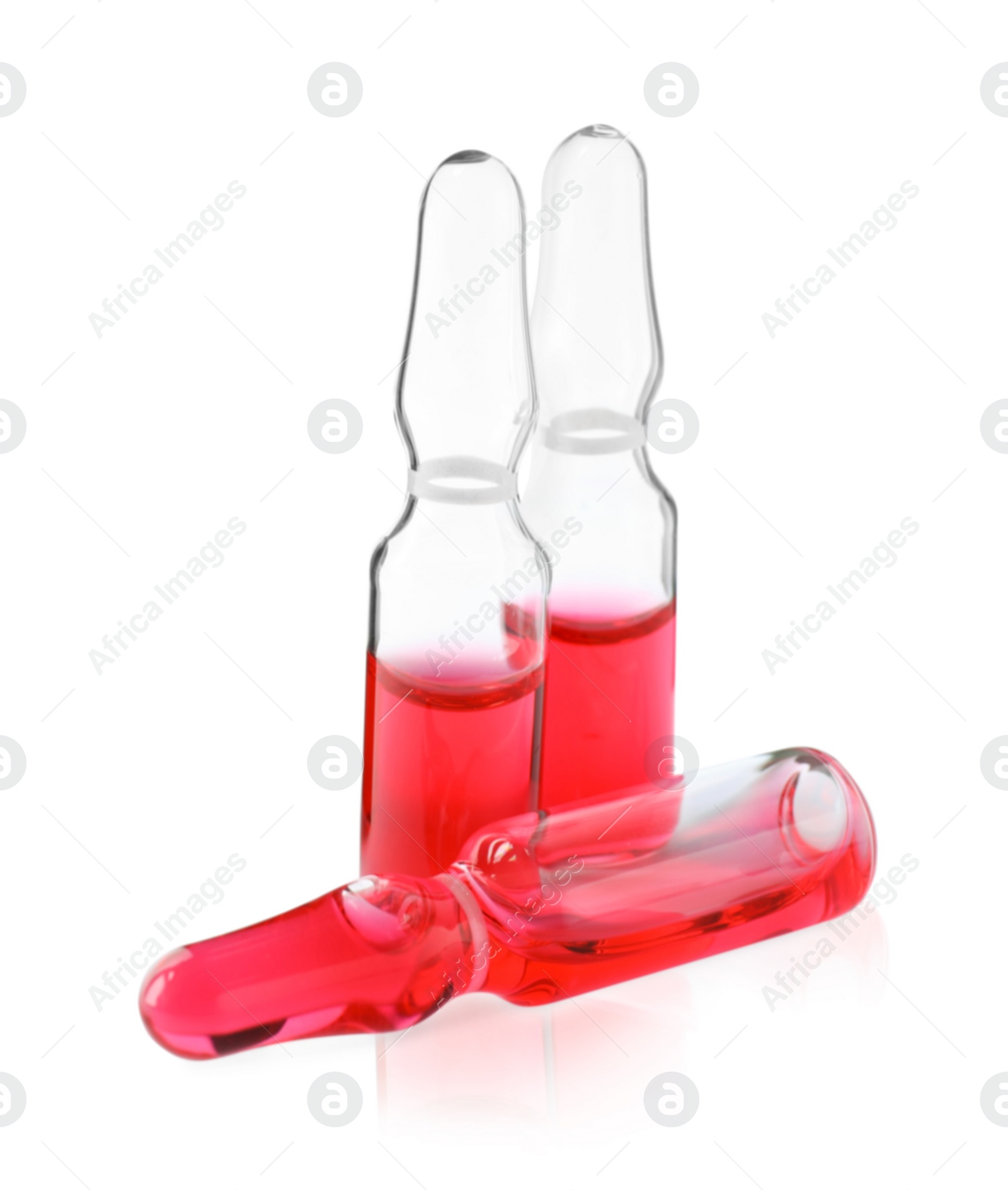 Photo of Pharmaceutical ampoules with medication on white background