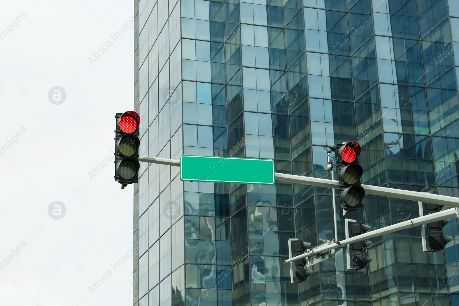 Photo of Overhead traffic lights in city. Road rules