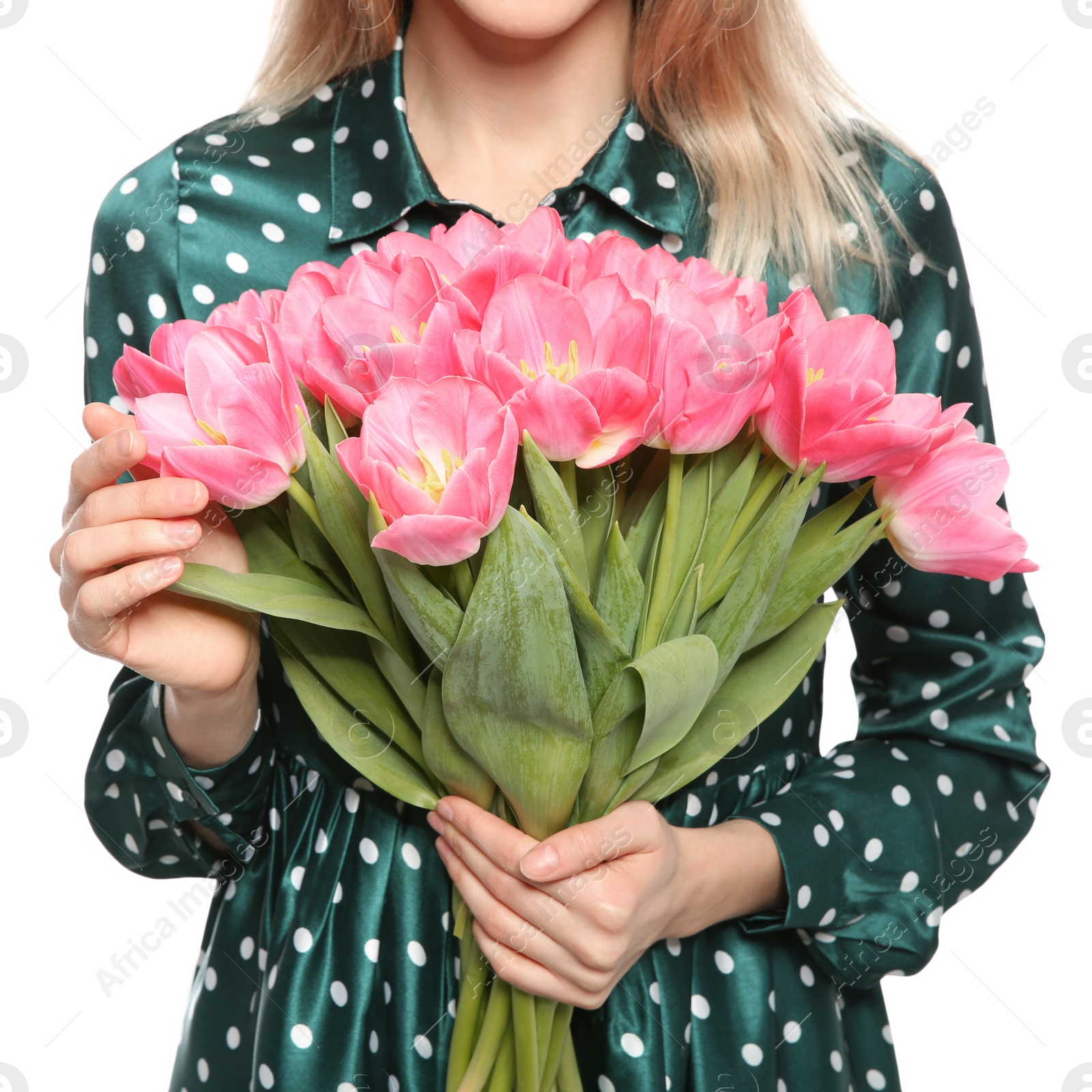 Photo of Young girl with beautiful tulips on white background, closeup. International Women's Day