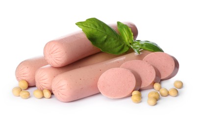 Photo of Fresh raw vegetarian sausages, basil and soybeans on white background