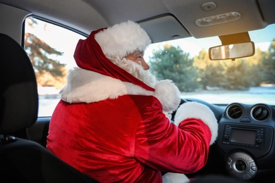Authentic Santa Claus driving car, view from inside