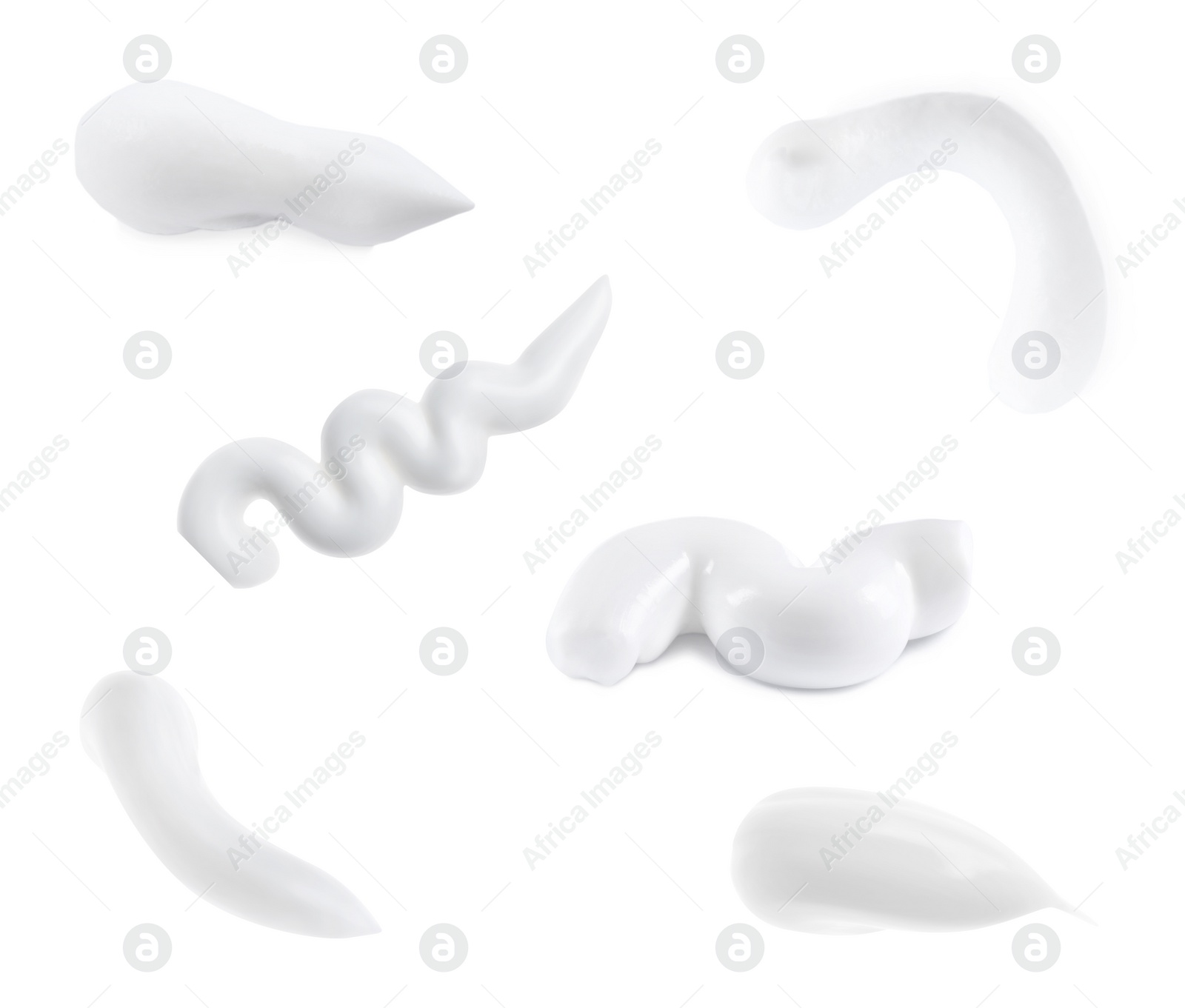 Image of Set with smears of toothpaste on white background