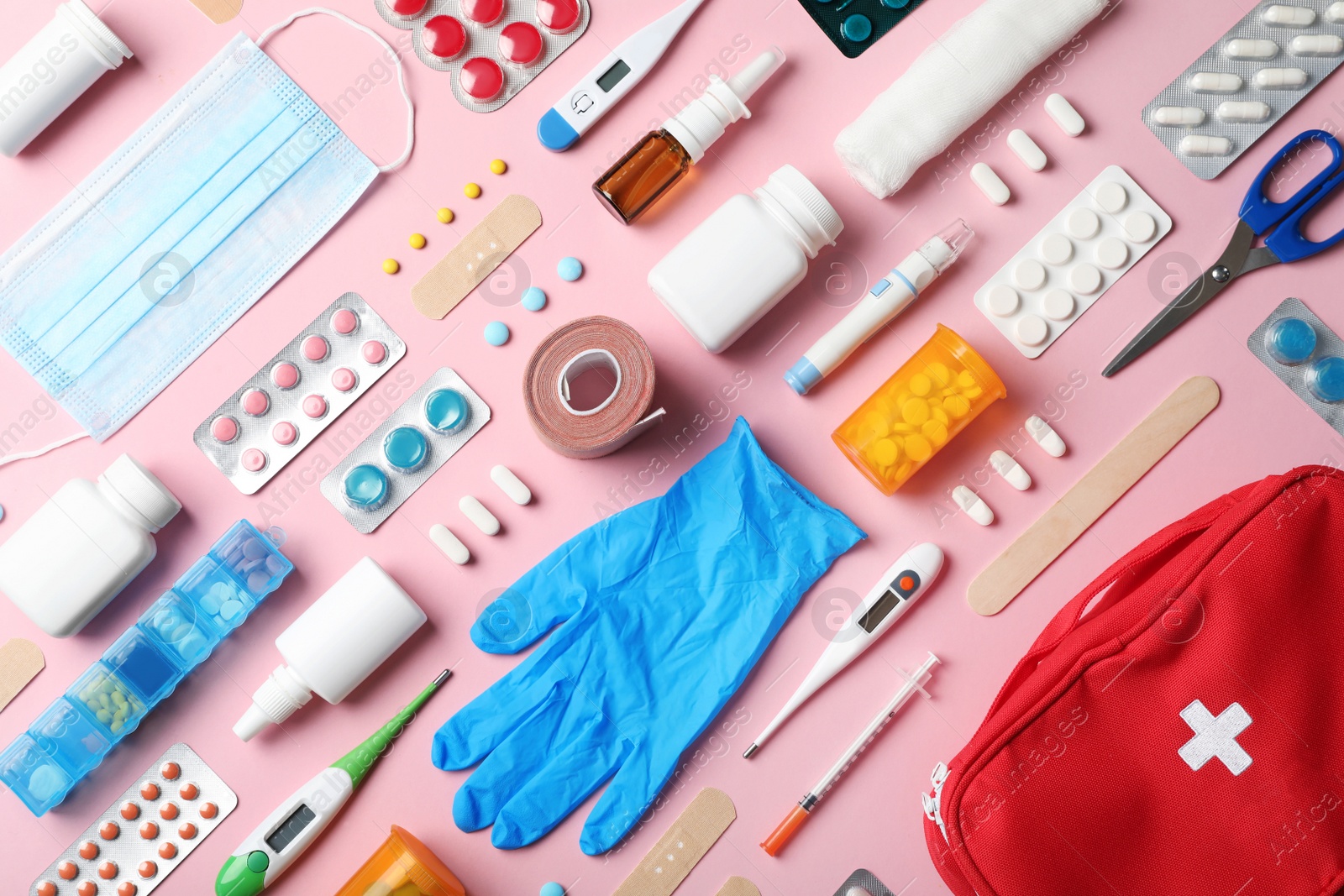 Photo of Flat lay composition with first aid kit on color background