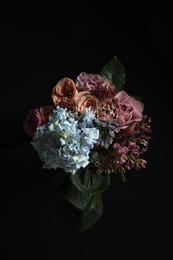 Photo of Beautiful bouquet of fresh flowers on dark background