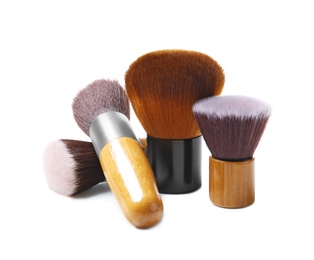 Makeup brushes of professional artist on white background