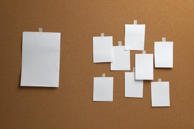 Photo of Blank white paper sheets on cork board