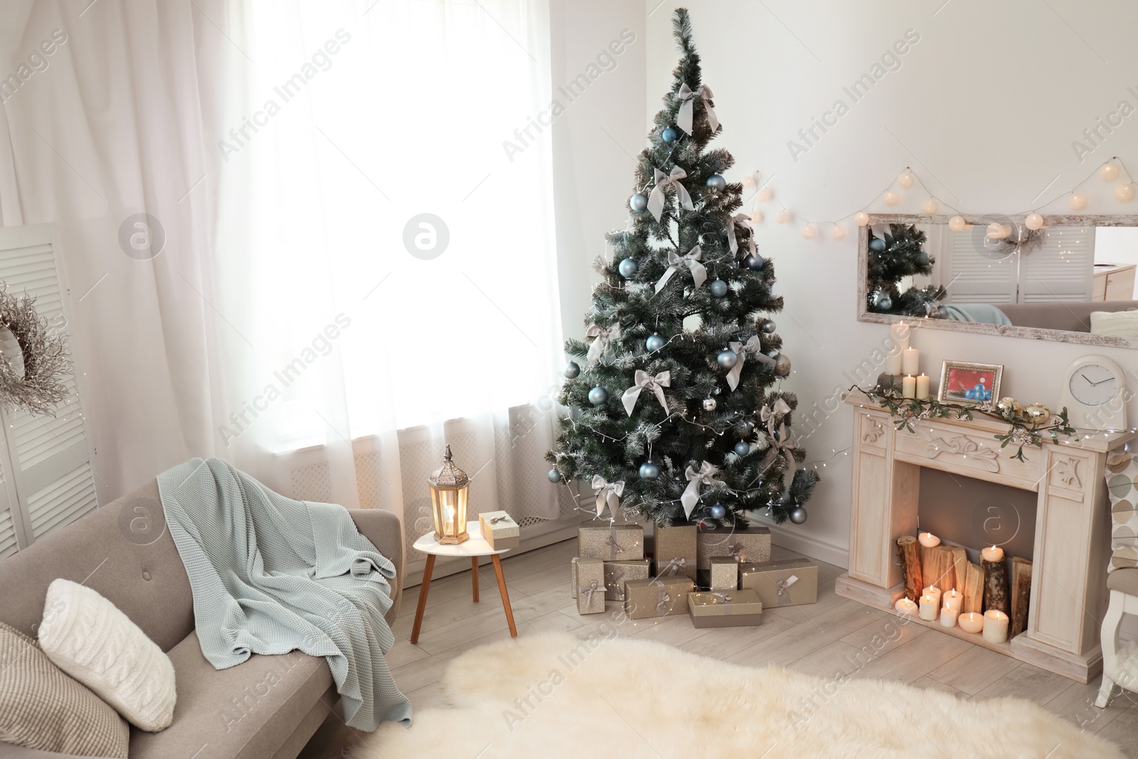 Photo of Stylish living room interior with decorated Christmas tree