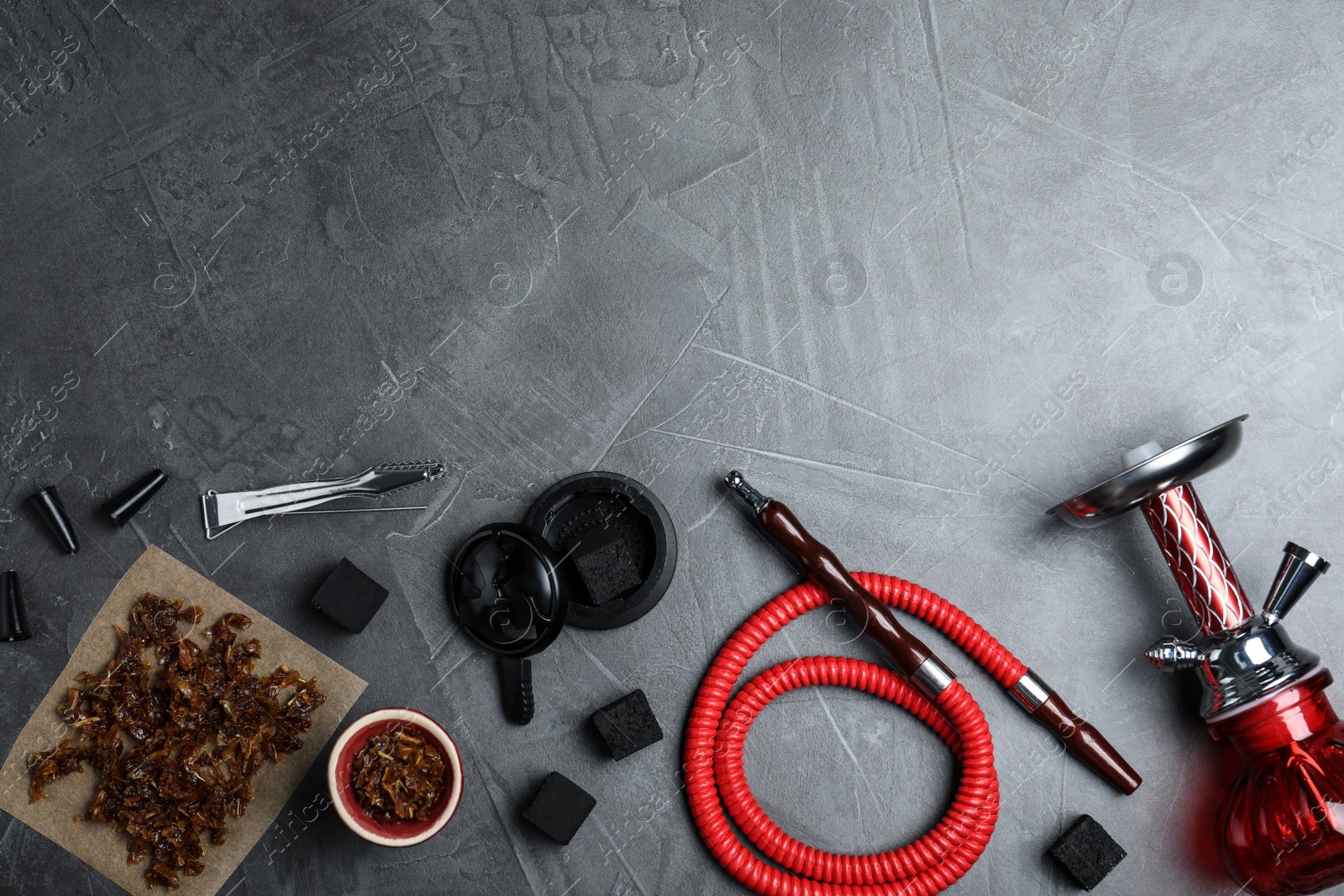 Photo of Flat lay composition with parts of hookah on grey table, space for text
