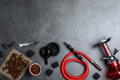 Flat lay composition with parts of hookah on grey table, space for text