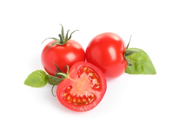 Photo of Fresh cherry tomatoes with basil isolated on white