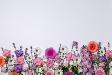 Photo of Flat lay composition with different beautiful flowers on white background, space for text