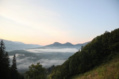 Photo of Beautiful view of mountains covered with fog