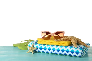 Photo of Set of beach accessories on table against white background. Space for text