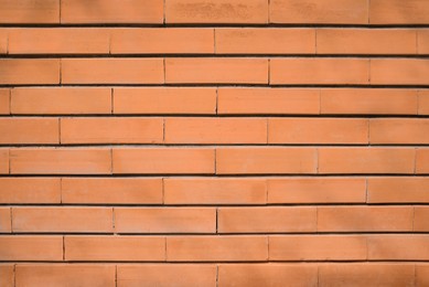 Texture of red brick wall as background, closeup view