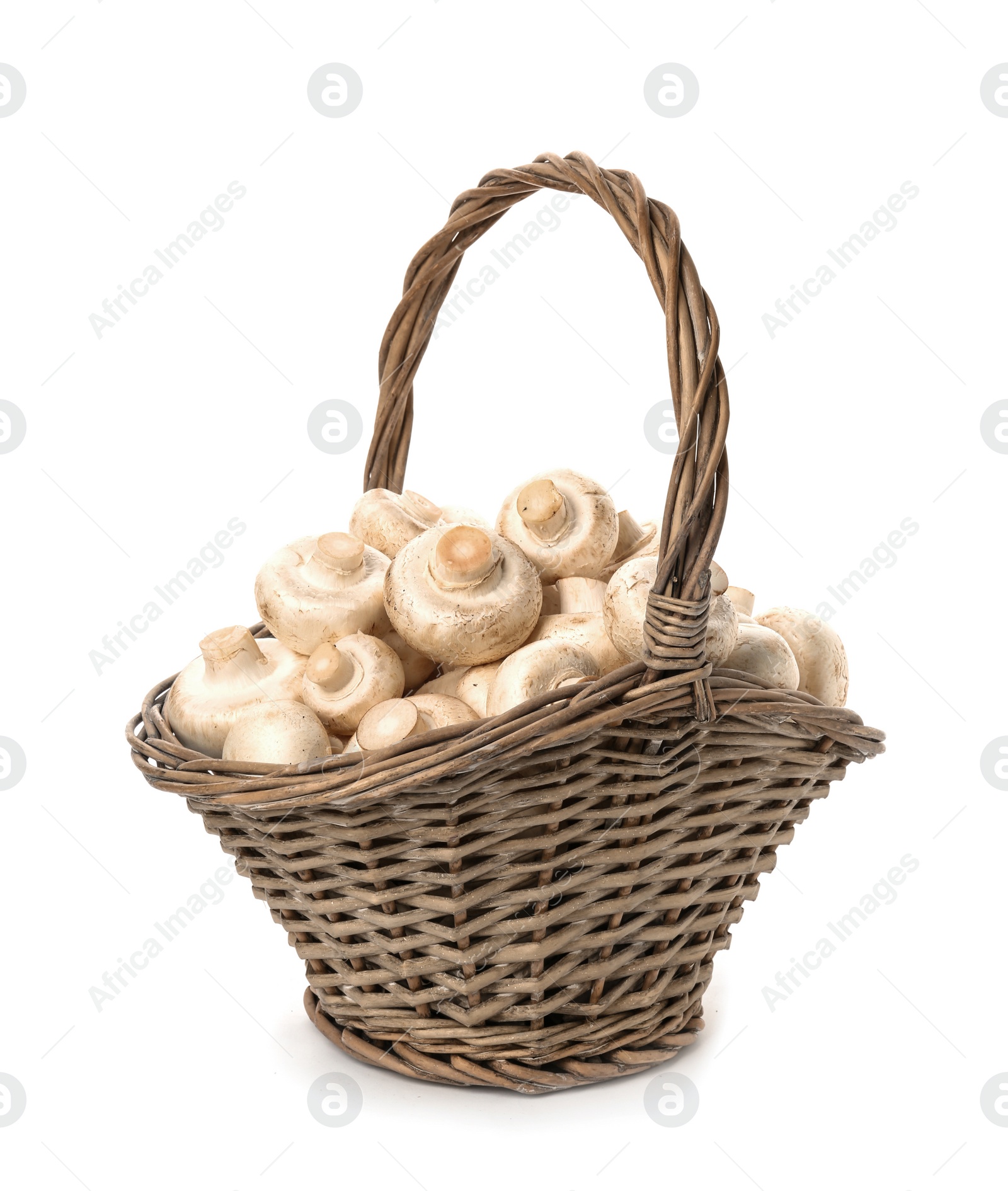 Photo of Wicker basket with fresh raw champignon mushrooms on white background