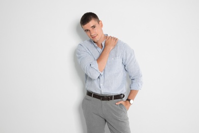 Photo of Portrait of handsome young man on light background