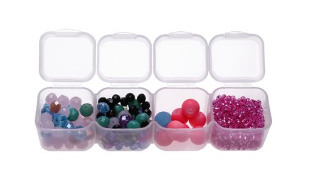 Photo of Plastic organizer with different beads isolated on white