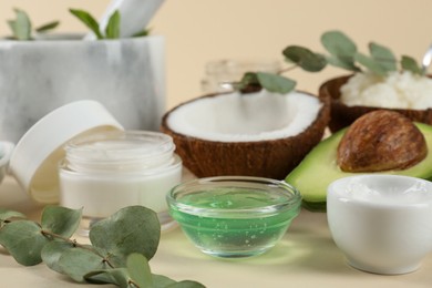Photo of Homemade cosmetic products and fresh ingredients on beige background, closeup. DIY beauty recipe
