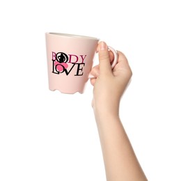 Image of Woman holding cup with words Body Love, pink heart and silhouette of woman in letter O on white background, closeup